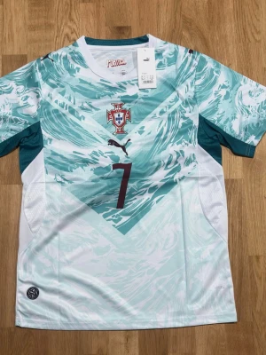 Portugal Away Jersey 2026 World Cup Ronaldo #7 – Size M - 🇵🇹 Iconic Portugal 2026 Away Jersey with Cristiano Ronaldo #7. Perfect for fans, collectors, or everyday wear. Lightweight, comfortable, and a must-have for any Ronaldo supporter.