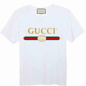 Gucci T-Shirt  Fabric: 100 Percent Cotton   Color: White   Sleeve: Half Sleeve   Pattern: Printed   . Neck Shape: Round   . Fit: Regular Fit