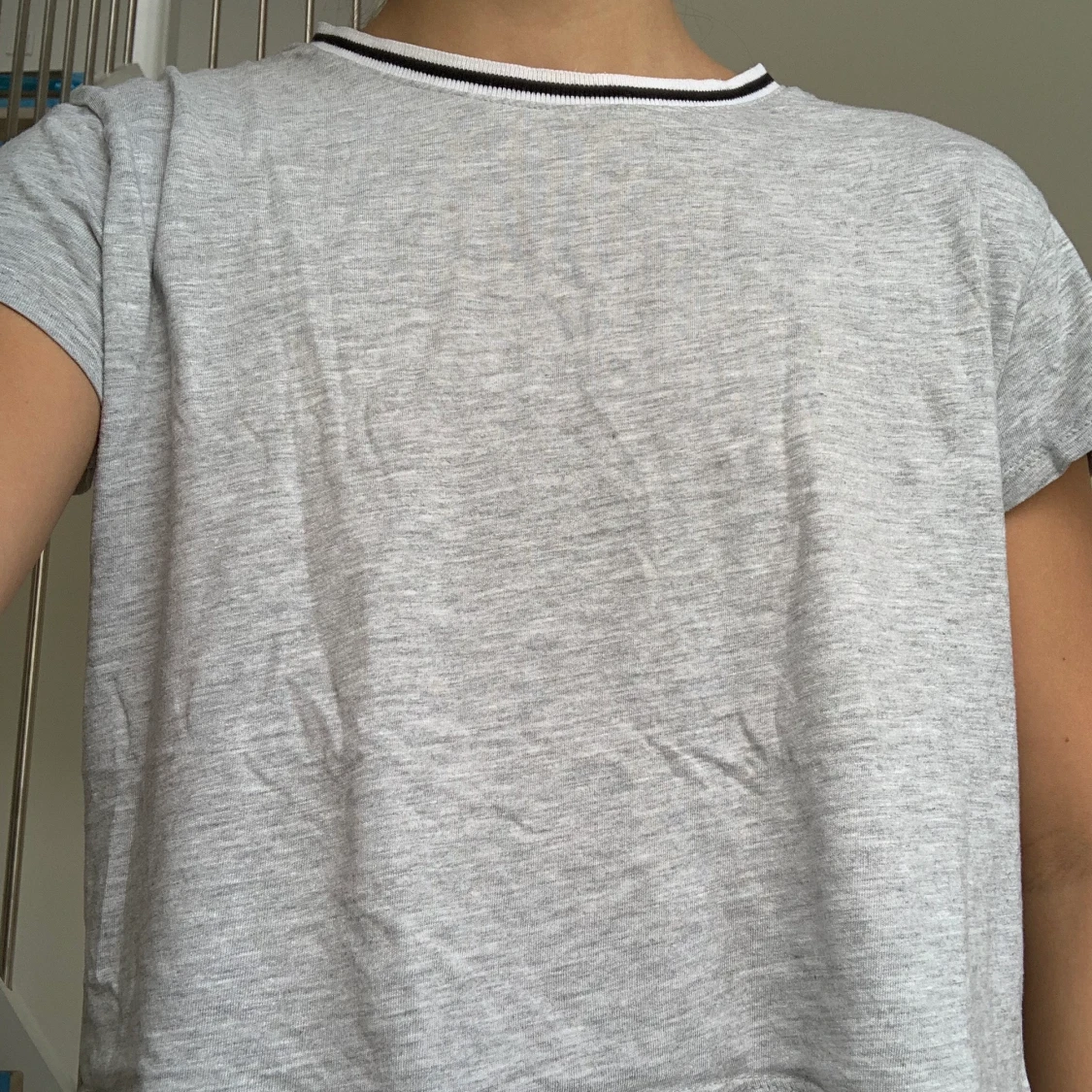 Grey t-shirt with black and white lining on the color  - 90
