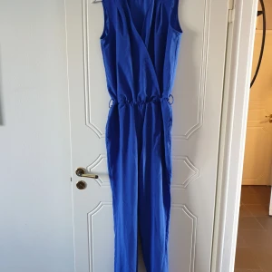 NEW bright blue jumpsuit - Brand new blue jumpsuit. Size 36, but can also work for 38. 