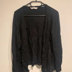 Long armed black cardigan with very soft and cozy material, from Target Australia, worn but in good condition. 