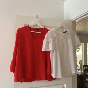 Blusar  - En röd blus i storlek 34, stor i storleken. Använd fåtal gånger. Vit blus i storlek 38, använd 1 gång. 50 kr/styck 