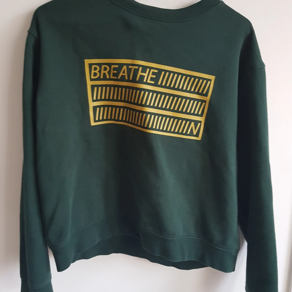 Grön tröja med tryck