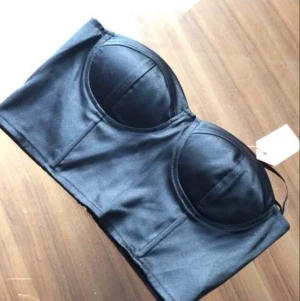 Black Top  - New top, looks very good on body, keeps your beauties in a nice shape! I would say rather small breasts up to B. 