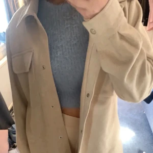 beige kappa - Beige kappa men använder inte eftersom jag har 2