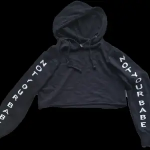 En svart hoodie med print (not your babe). Nästan aldrig använd. Köparen står för frakt!