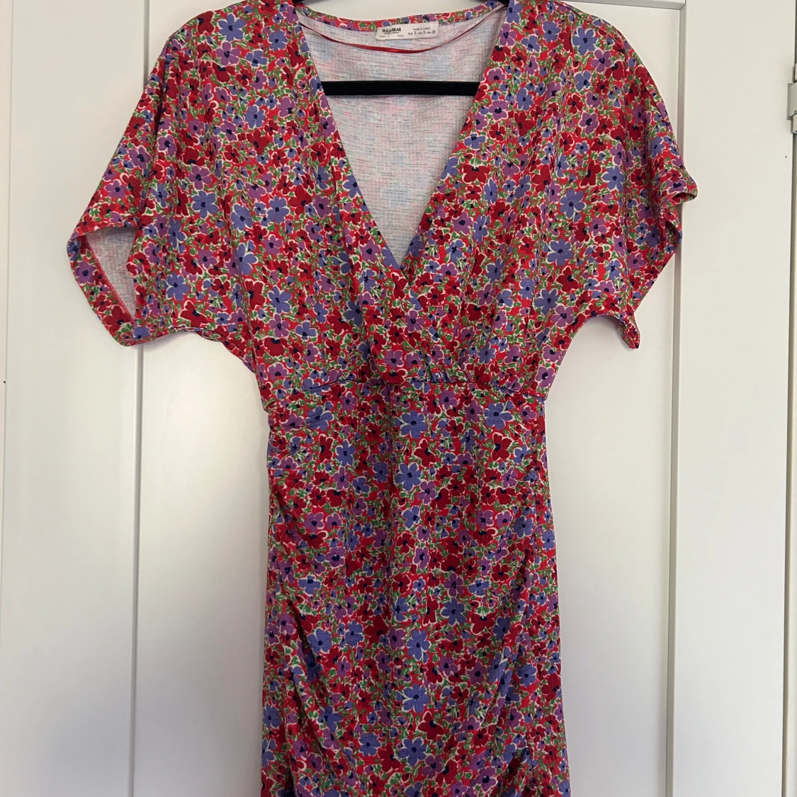 Tajt miniklänning ”omlott”