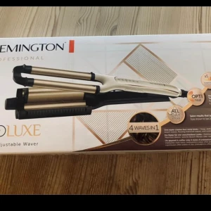 Stor locktång  - Helt oanvänd locktång från Remington med stora plattor. Ej använd p ga storleken. Passar troligen bättre för längre hår. Ger större lockar.  Nypris 499:-  Endast öppnad förpackning. 