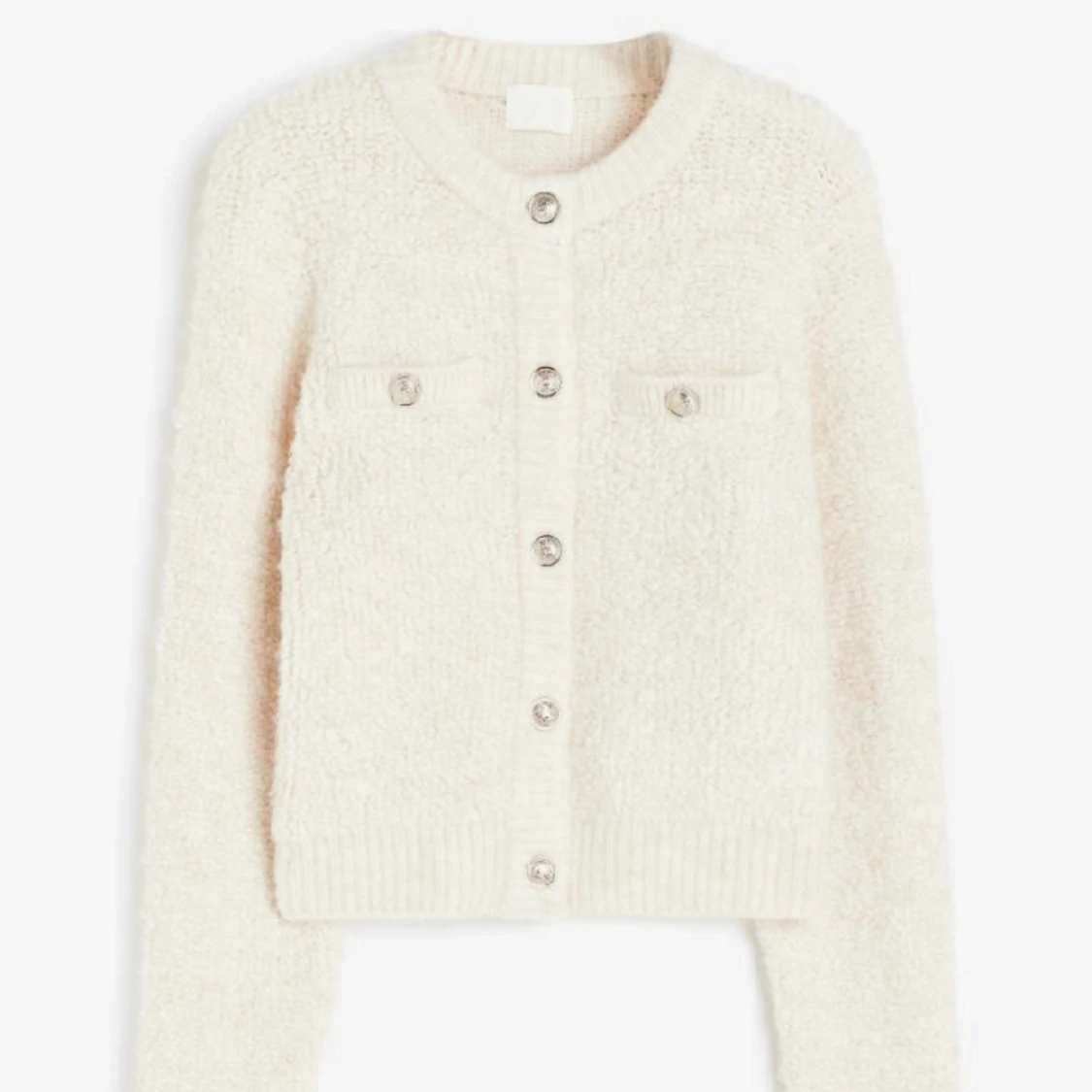 Kofta i boucle med knappar