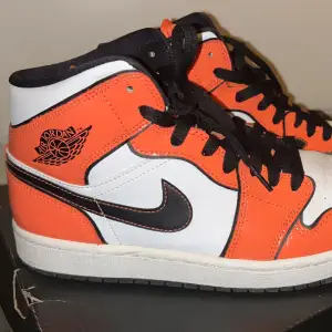 Pair of Air Jordan 1 Mid Turf Orange used only few times is in very good condition 