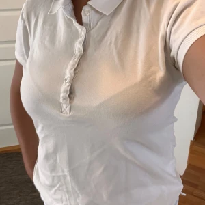 White Polo shirt - Used only a couble of times In a perfect condition and no defects