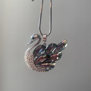 Swan pendant / amulet (necklace) - Swan pendant/amulet that has never been worn. It’s very pretty but not my style :(  All the crystals are intact and shiny. The silver chain doesn’t come with it!   You pay for shipping 💕