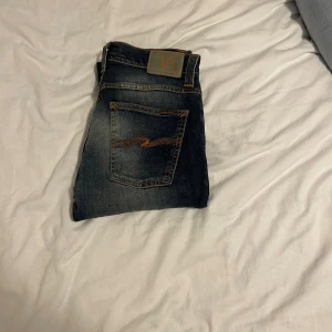  Nudie Jeans W31 L32 - Modell Grim Trim | Storlek W31 L32 | bra skick med sjuk tvätt