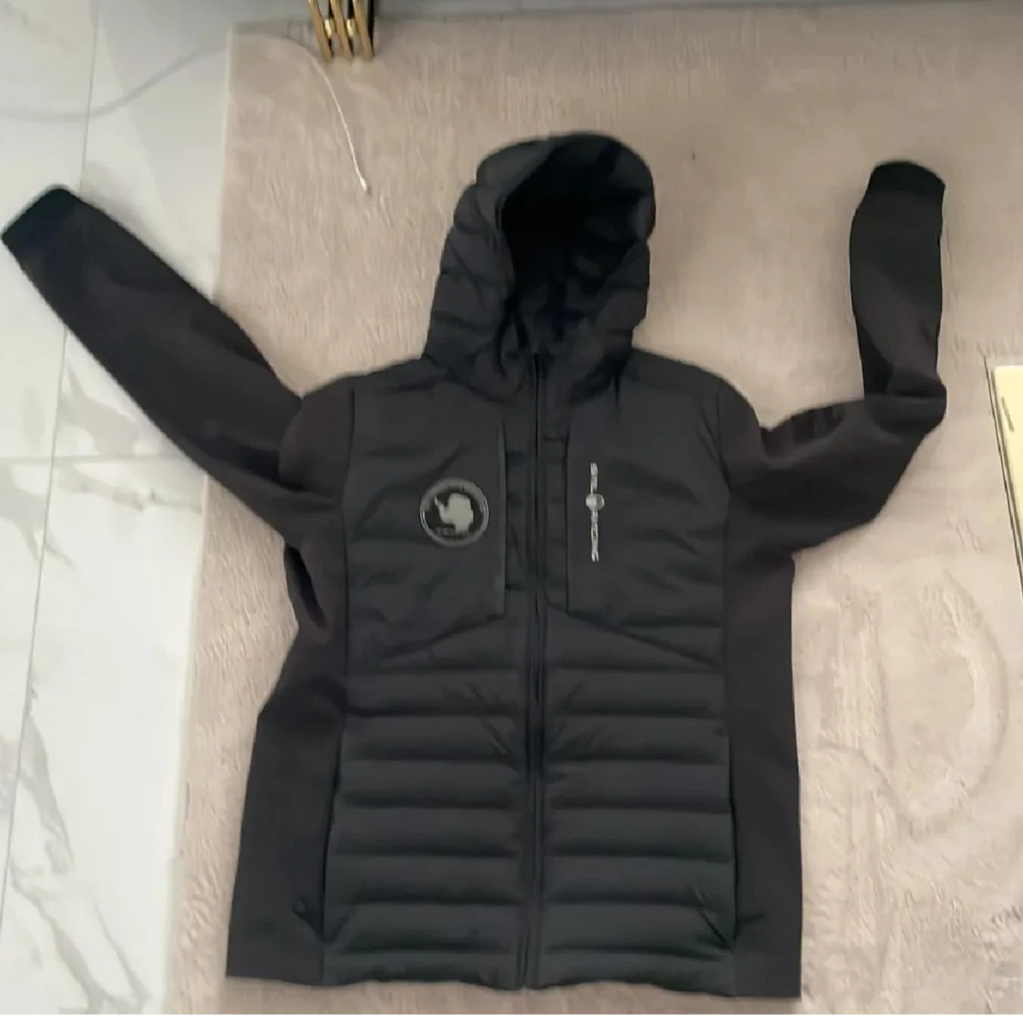 Svart pufferjacka från Sail Racing