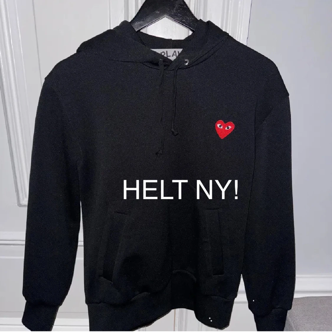 Svart hoodie från Comme des Garçons