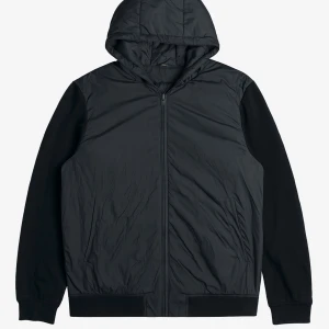 Svart vindjacka från Massimo Dutti - Svart vindjacka med huva från Massimo Dutti. Jackan har slät framsida, dragkedja och är tillverkad i en mix av ull och syntet. Ärmarna är i mjukare tyg och kroppen har en lätt glansig finish. Perfekt för dig som gillar stilren och enkel look.