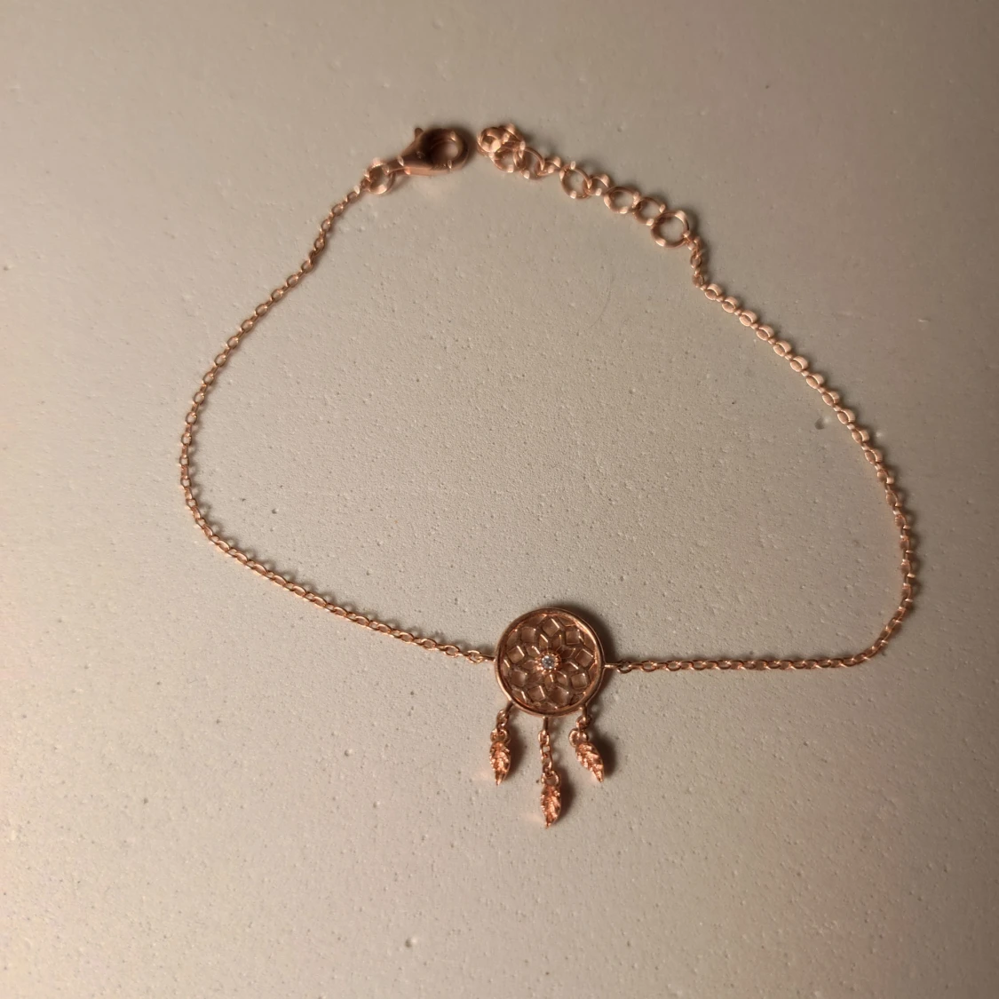 Roséguldfärgat armband med drömfångare