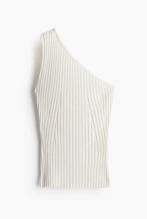 Vit ribbad one shoulder topp - Säljer en vit ribbad topp med one shoulder-design. Toppen är ärmlös och i mycket bra skick.
