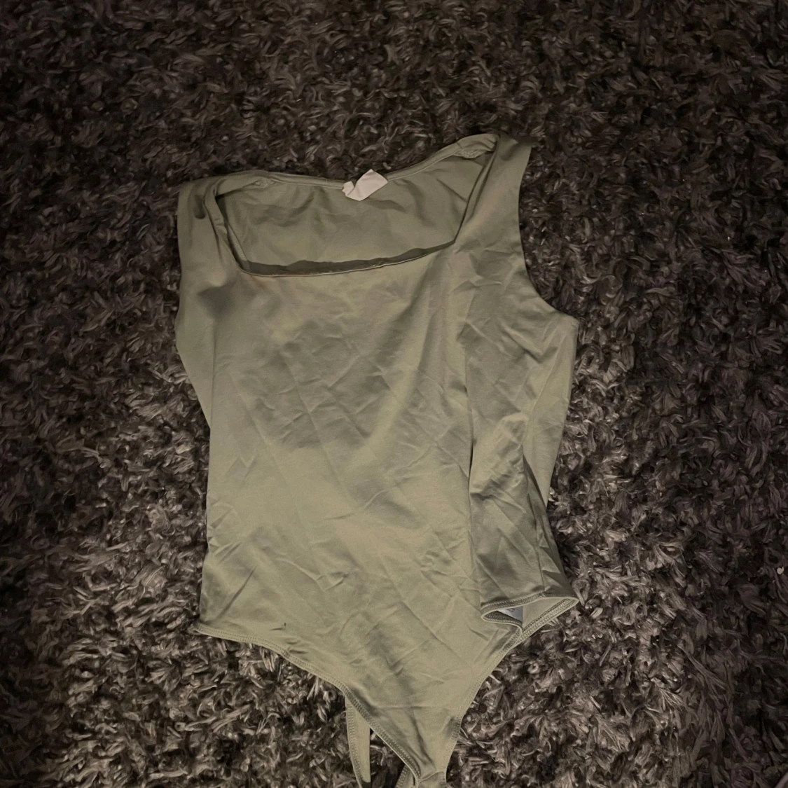 Ljusgrön ärmlös bodysuit från Aritcot