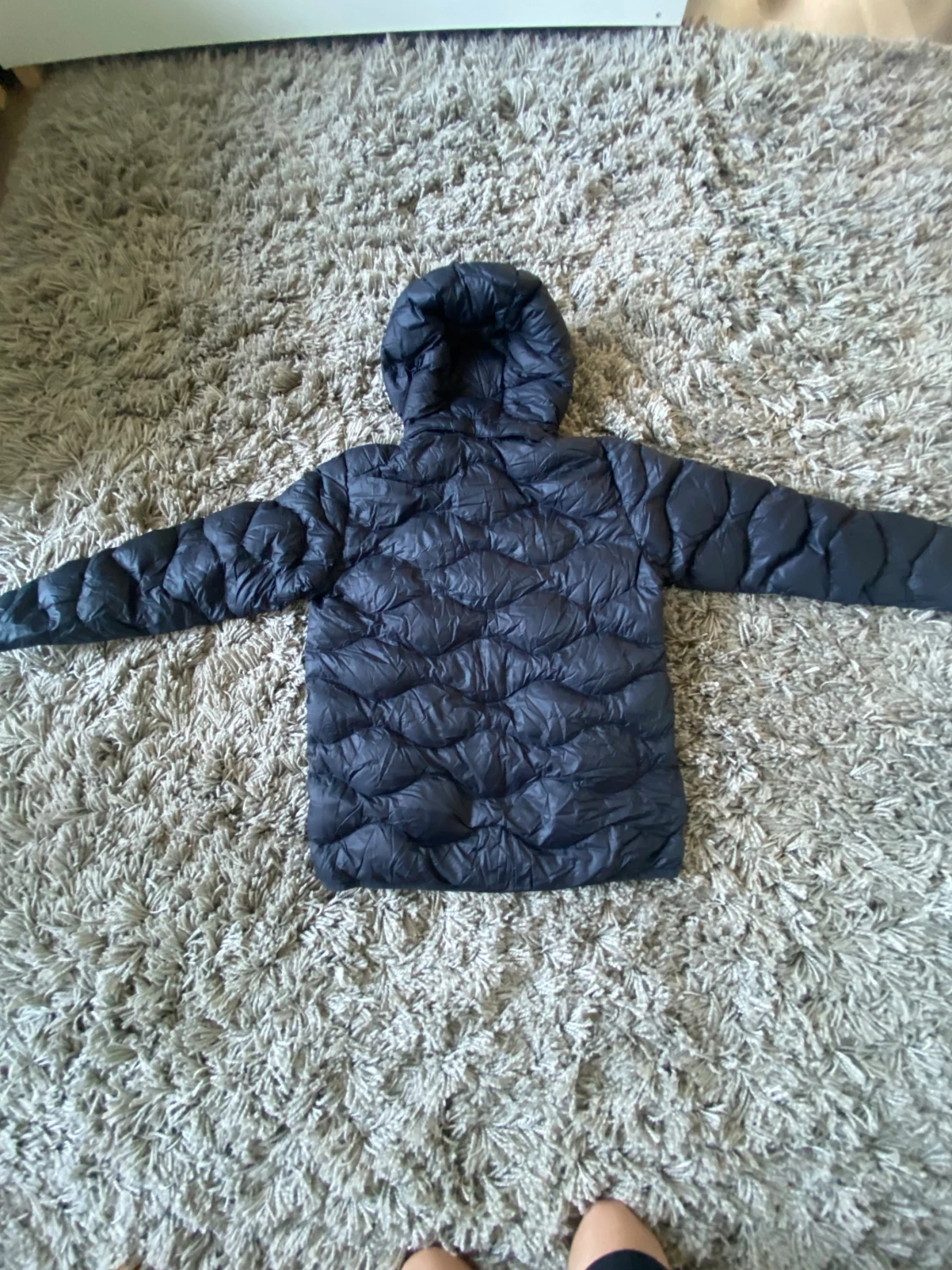 Svart dunjacka Peak Performance 160 - 1