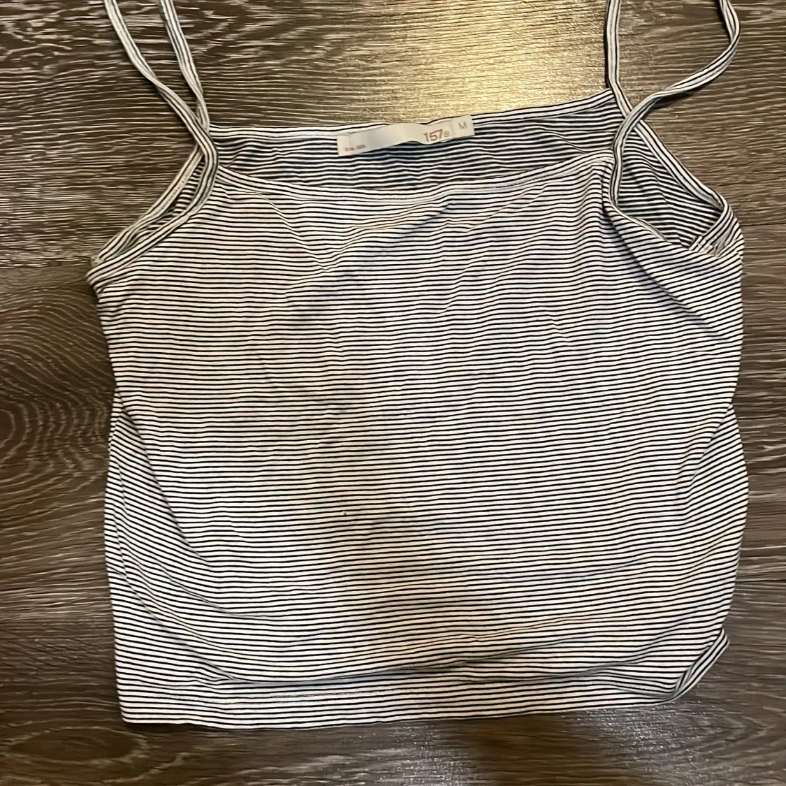 Randig linnetopp från 157, M