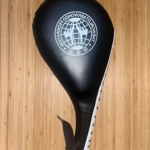 Taekwondo Black Kicking Pad - Perfect conditioned kicking pad for taekwondo uses. Perfect for training self defense or martial arts. Purchase this pad for the best results possible and to take your kicks to next level.