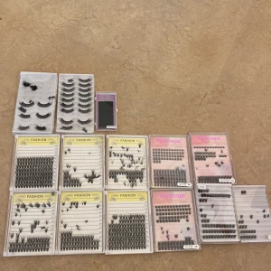 Stort kit med lösögonfransar - Säljer ett stort kit med olika lösögonfransar i både hela remsor och individuella knippen. Dom är använda.Färgen är svart och fransarna finns i olika längder och tjocklekar. Perfekt för att skapa allt från naturliga till dramatiska looks. Flera förpackningar från Fashion och Yuanzhijie ingår.