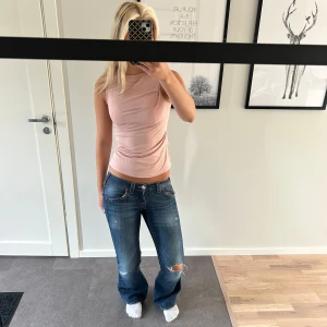 Ljusrosa ärmlös topp Tiger of Sweden - Supersnygg ljusrosa ärmlös topp från Tiger of Sweden. Bra skick och i storlek S.