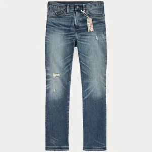 Ralph lauren blå jeans med slitningar - Snygga Ralph lauren jeans i blå denim med slitna detaljer och lätt tvättad look. Modellen är slim och har klassisk femficksdesign, normal midja och raka ben. Perfekta för dig som gillar en avslappnad men trendig stil. Kan gå ner i pris vid snabb affär. Ny pris 3499kr