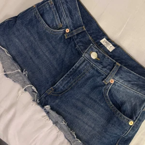 Jeanskjol - Blå jeansshorts från Lindex