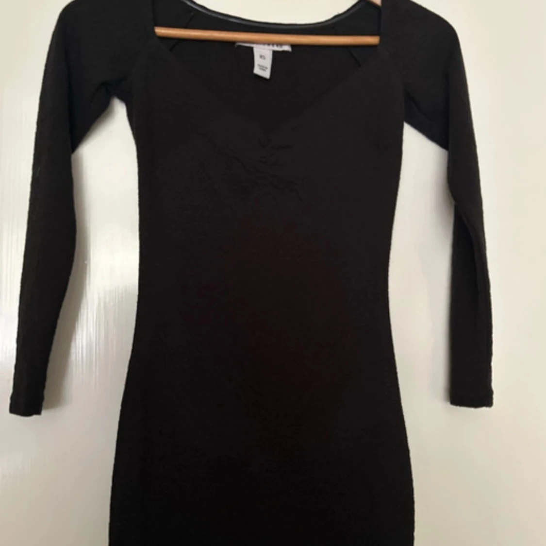Svart långärmad klänning från NLY Trend