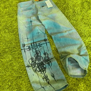 Affliction style Baggy Lee jeans - Affliction style Baggy Lee jeans Customized  W26/L31 (38cm x 99cm) Brand new with tags  ♻️All pictures are taken on green “grass” carpet as Hygiene is my priority♻️  For more information text me in private messages  #Y2KFashion # Y2KHipHop #BaggyClothes #Streetwear #VintageStreetwear #2000sStyle #RapFashion #ThrowbackStyle #OldSchoolHipHop #BaggyJeans #Y2KOutfit #HipHopAesthetic #RetroStreetwear #VintedFinds #OversizedFashion #UrbanWear #2000sVibes #TrendyVintage #RareStreetwear #VintedStyle