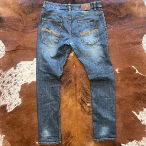 Vintage RawDenim Nudie RegularRalf - Tjena! Säljer dessa sjukt feta Rawdenim Vintage Nudie jeansen i modellen RegularRalf, Storleken är W36 och passar mig som är 186, hör av dig vid funderingar!🙌