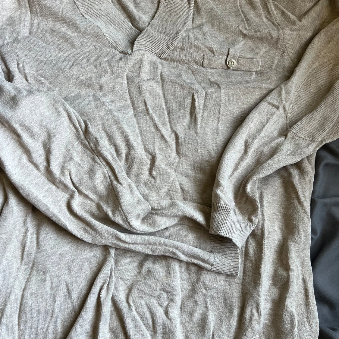 Beige stickad polotröja från Redwood