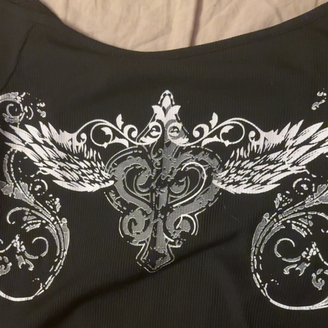 Svart långärmad topp med silvertryck