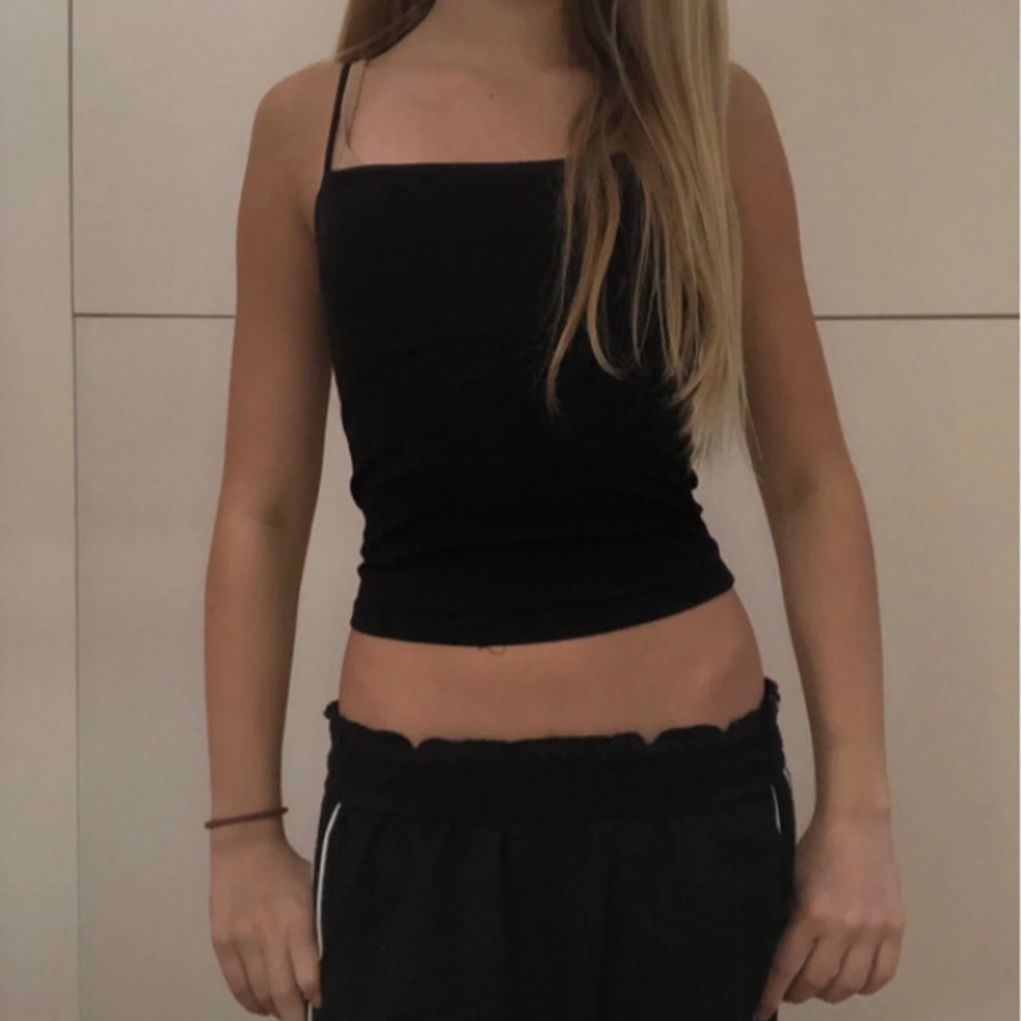 Svart ärmlös linnetopp