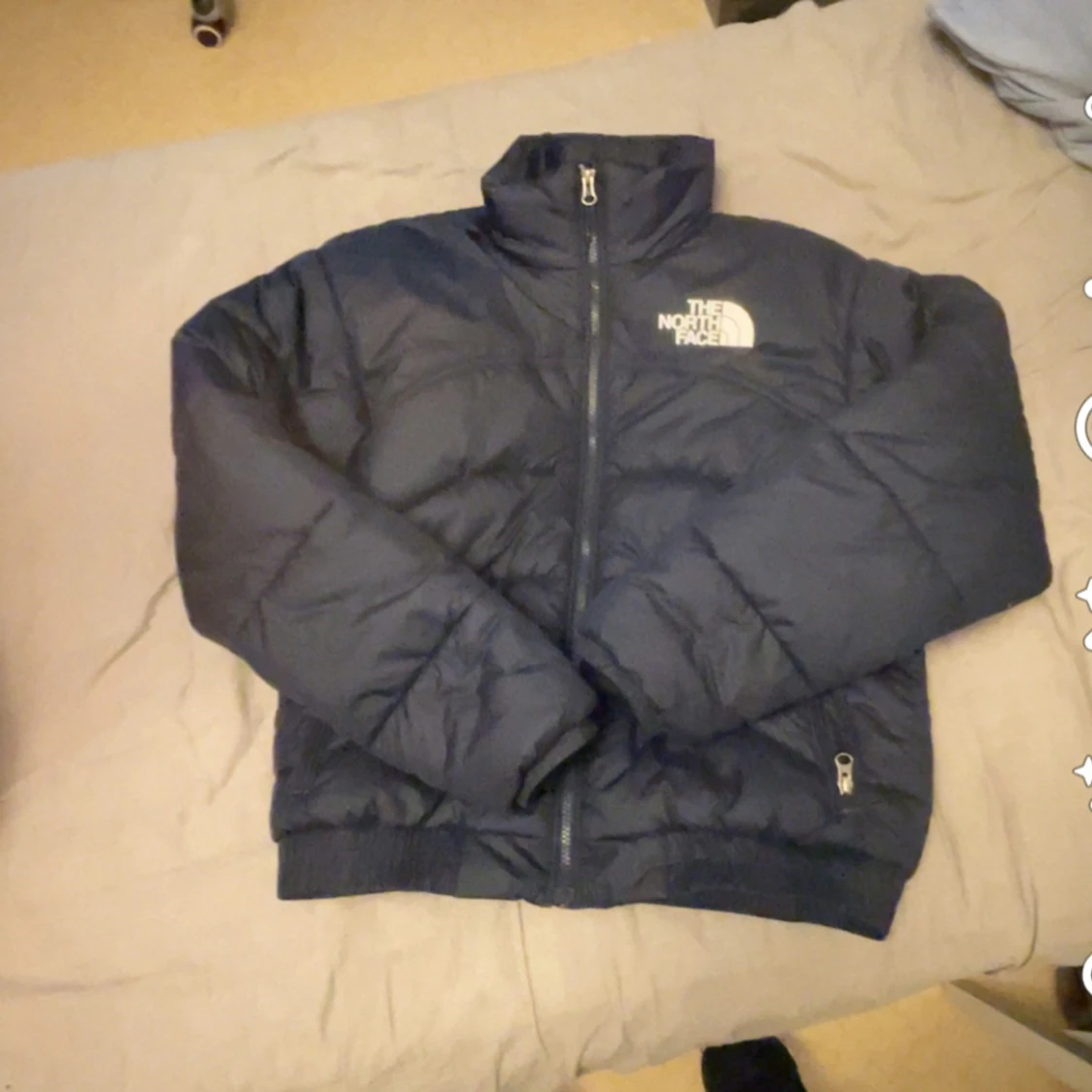Blå dunjacka från The North Face - 1