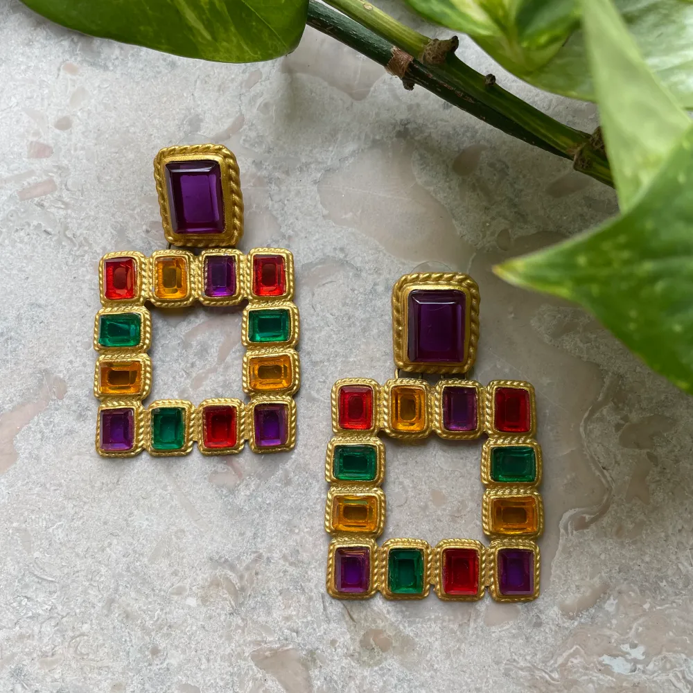 Here's a beautiful 90s vintage set of cocktail earrings. Rope Knot Trimmed Metal earrings. Golden color with multicolor crystal beading. Meant for pierced ears. Make a statement with a sleek bun & blazer combo. Excellent Condition.  5x7cm  #jewelry. Accessoarer.