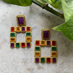 Here's a beautiful 90s vintage set of cocktail earrings. Rope Knot Trimmed Metal earrings. Golden color with multicolor crystal beading. Meant for pierced ears. Make a statement with a sleek bun & blazer combo. Excellent Condition.  5x7cm  #jewelry