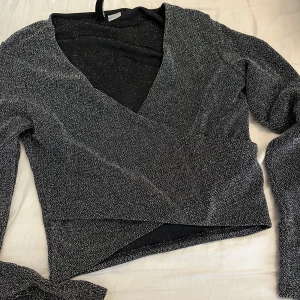 Glittrig topp - Nästan aldrig använt 