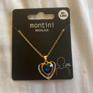 Halsband  - Ett halsband med ett hjärta på, ( inte riktigt guld) står ej för frakten 😊