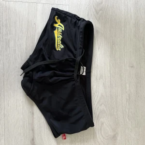 Aussiebum badshorts/trunks - Obefintligt använda badshorts. Små i storlek, mer som small