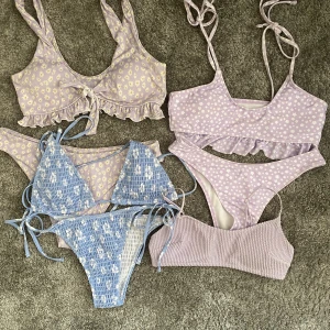 Bikinis - Jättefina bikinis, använda fåtal gånger.   -den blå, strl M (mer som S), Shein, 70kr   -lila med knut, strl S, Shein, 50kr   - lila till höger, strl S (mer som XS), Shein, 50kr   -lila topp, strl 36, H&M, som ny 50kr