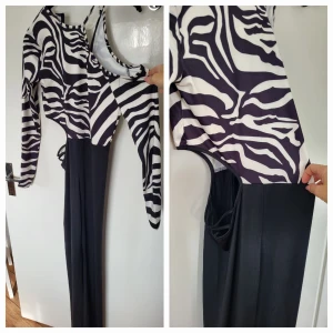 Byxdress - Snygg Byxdress .aldrig använd.one shoulder,öppen på ena sida vid revbenen,sitter snyggt