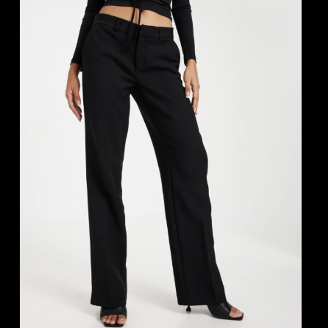 Svarta kostymbyxor  - 91