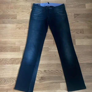 Lee Jeans - Lee Lynn Clean, lågmidjade 90-tals jeans, W25 L31