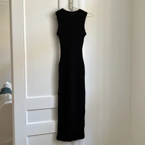 Långklänning - Långklänning ifrån reclaimed vintage som aldrig har kommit till användning 