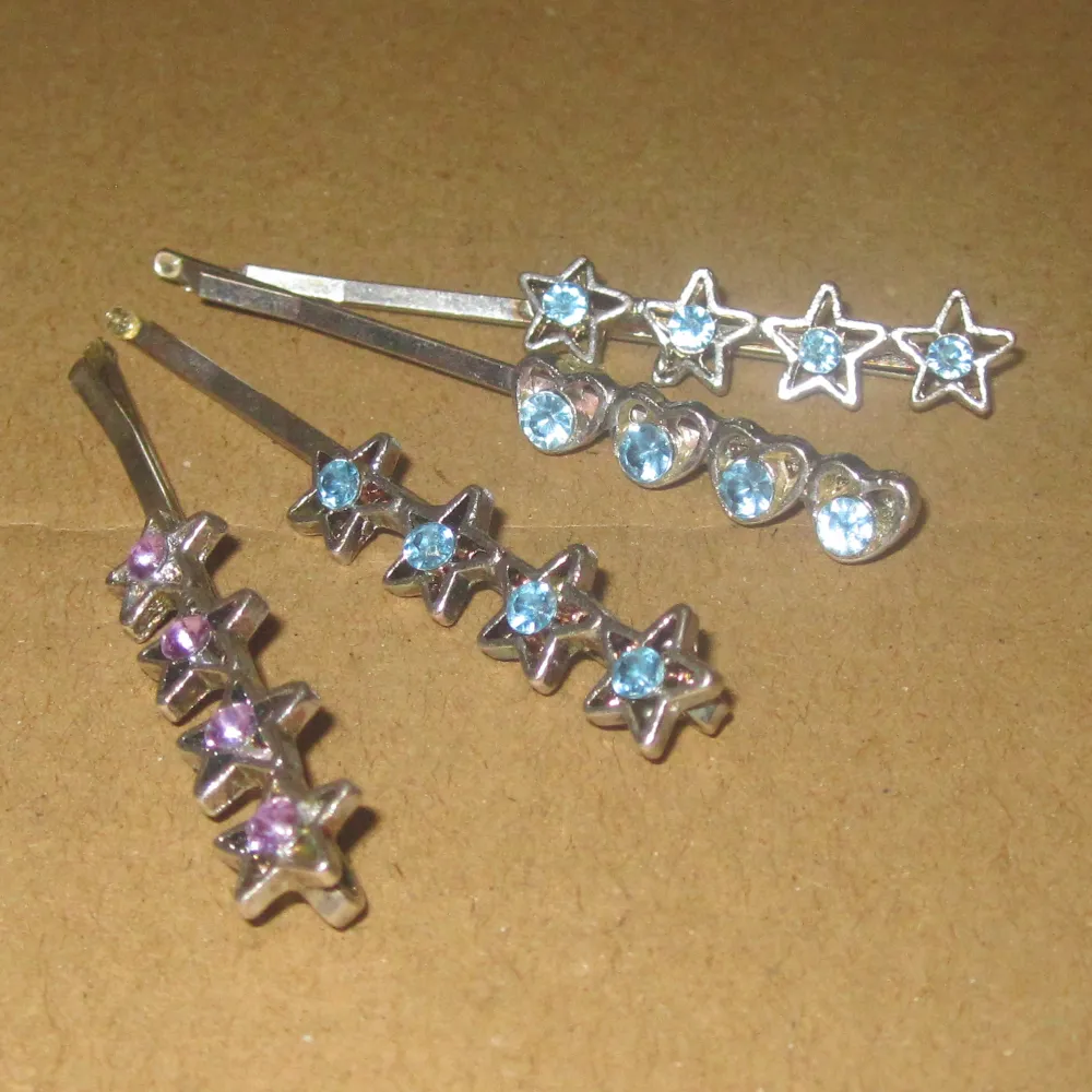 Icy blue rhinestone hair clips with hearts and stars   In good condition   DM me for questions   . Accessoarer.