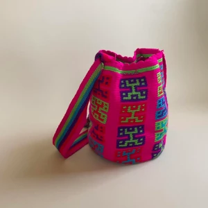Vintage Colombian Bag - This vintage Mochila bucket bag is made in Colombia with colorful threads made of Cotton and Aloe.   Drawstring Closure with Fringed Tassels  30 CM/14 IN Length of Bag (not including Strap) 25 CM/11 IN Width 53 CM/ 20.9 IN Drop  #bucketbag #shoulderbag #c