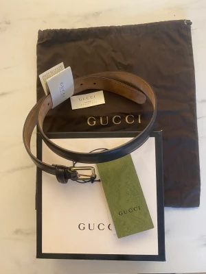Gucci bälte 92 cm - Läder Gucci bälte 92cm, mörkt brunt